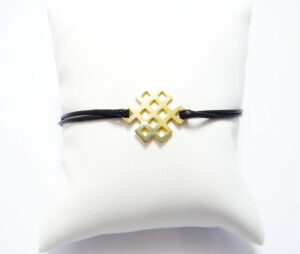 bracelet cordon coulissant et noeud infini en or jaune 18 carats